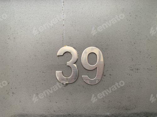 Preview: Closeup shot of number 39 in the address on the building wall