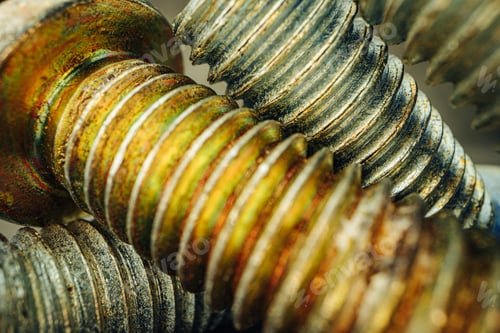 Preview: Many metal screws on concrete close up