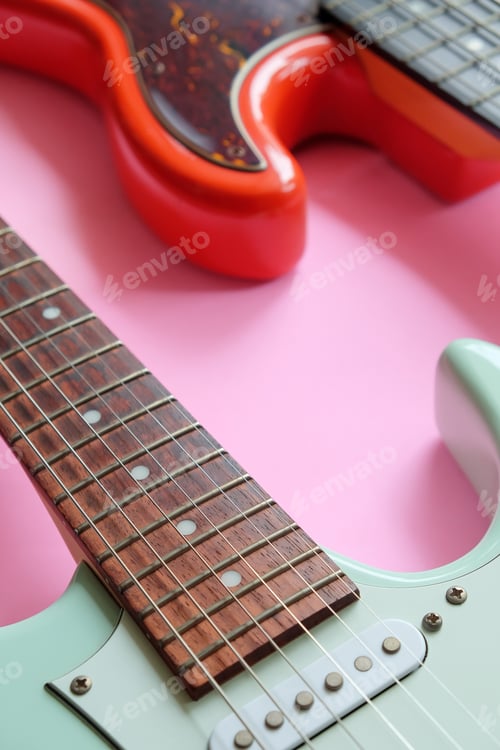 Preview: Electric guitar and bass guitar on a pink background