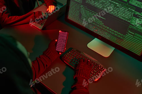 Preview: Anonymous people using computer and coding to break into system. Cyber attack. Cyber war. Hackers