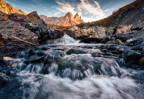 Preview: Iconic three peak mountain and waterfall flowing in the Aiguilles d Arves among the French Alps