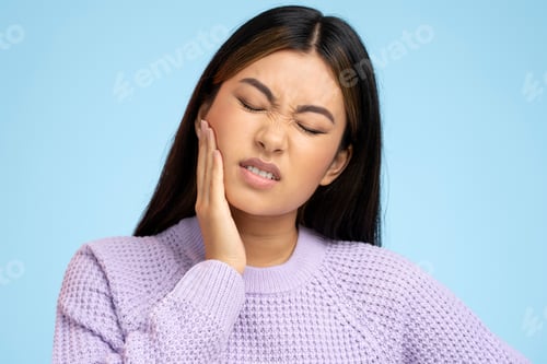 Preview: Portrait of unhealthy ill woman felling toothache after drinking hot or cold beverage