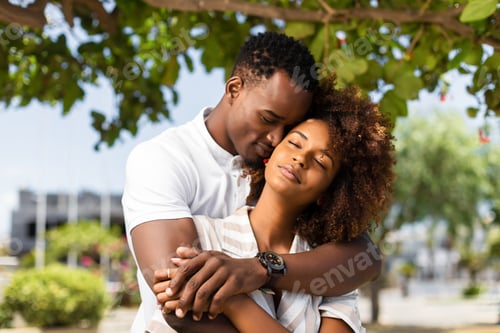 Preview: Outdoor protrait of black african american couple embracing each