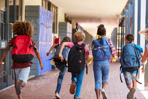 Preview: School kids running in elementary school hallway, back view