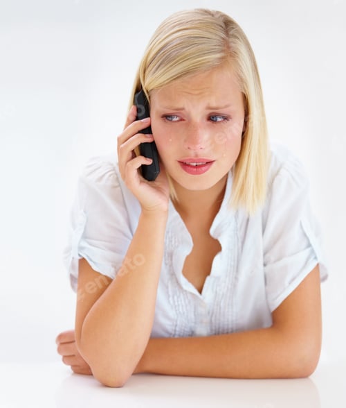 Preview: This cant be true. Shot of an attractive woman looking worried while talking on her cellphone.