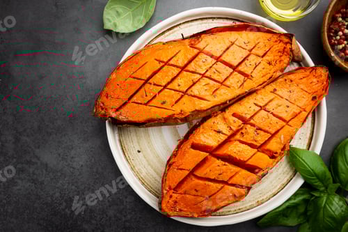 Preview: Roasted Sweet Potatoes Garnished with Basil Leaves