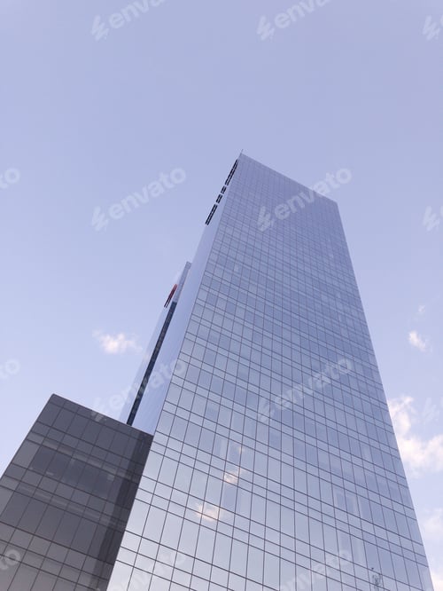 Preview: Modern Architecture: Glass Skyscraper Against Pale Blue Sky