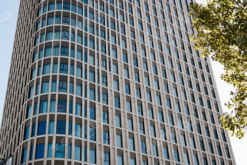 Preview: Multi-apartment high-rise residential building with round corners exterior, close-up