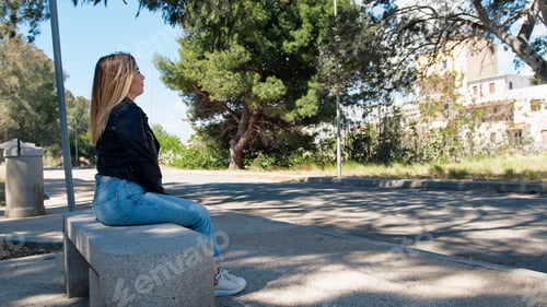 Preview: Woman Sitting On A Bench At The Park