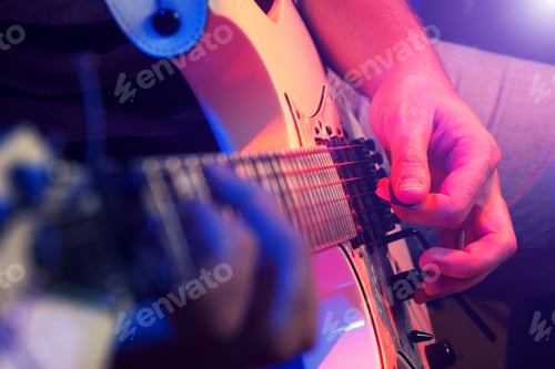 Preview: Close-up of the hands of a musician playing an guitar