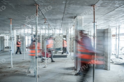 Preview: Six blurred construction workers on the go in busy construction site