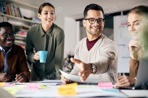 Preview: Team of young happy freelances brainstorming during business meeting in the office.