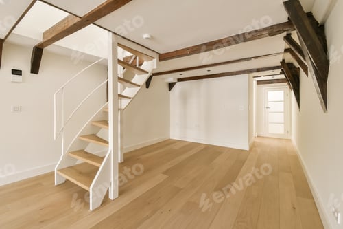 Aperçu: a white spiral staircase in a room with wooden floors