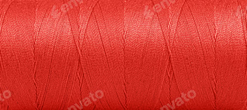 Preview: Texture of threads in a spool of red color on a white background