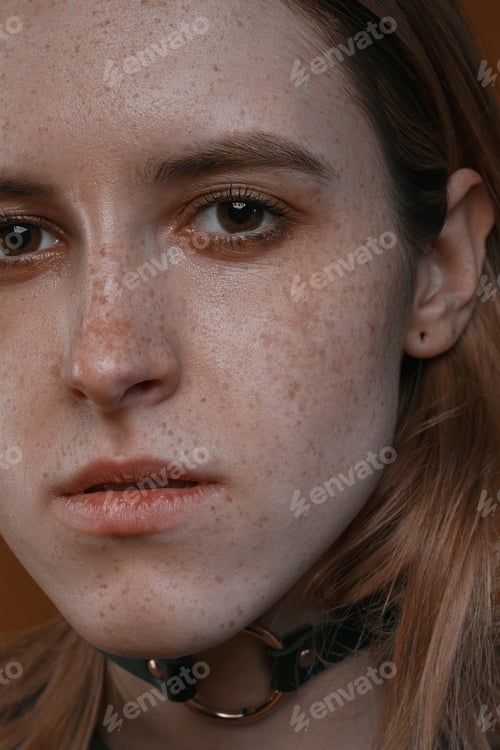 Preview: Portrait Of A Beautiful Girl With Freckles In Studio On A Brown Background