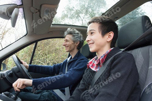Preview: Mature man and teenage son driving car