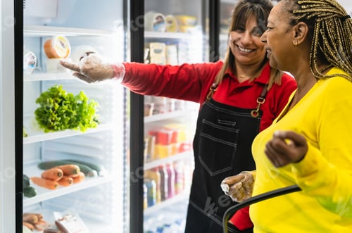 Preview: Senior African woman buying in supermarket