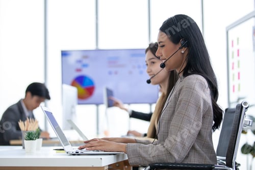 Preview: female operator agent with headsets and her team working in a call center customer service office.