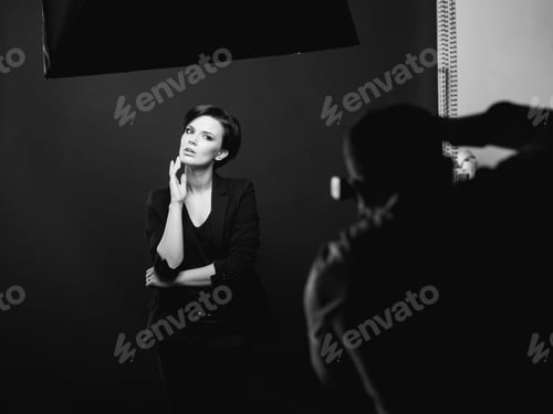 Preview: Woman posing in studio for male photographer
