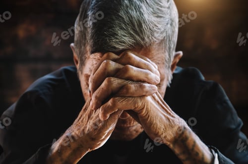 Preview: senior man covering his face with his hands.vintage tone