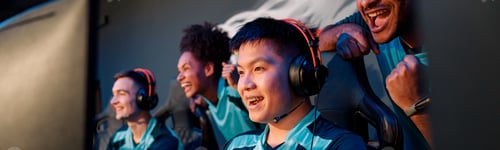 Preview: Young Asian man gaming with his friends in cyber club