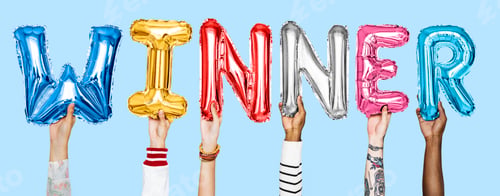 Preview: Hands holding balloons spelling Winner