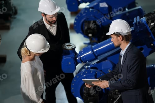 Preview: Robotics engineer working on maintenance of robotic arm in factory warehouse. Business technology.