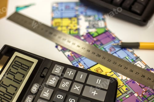 Preview: Top view of calculator, pen and ruler on blueprint plan of architecture building. Planning