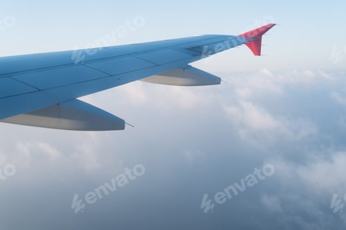Preview: Clouds under the wing of an airplane