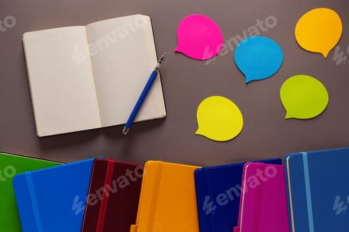Preview: Open notepad and notebook heap on paper table background. Back to school concept idea