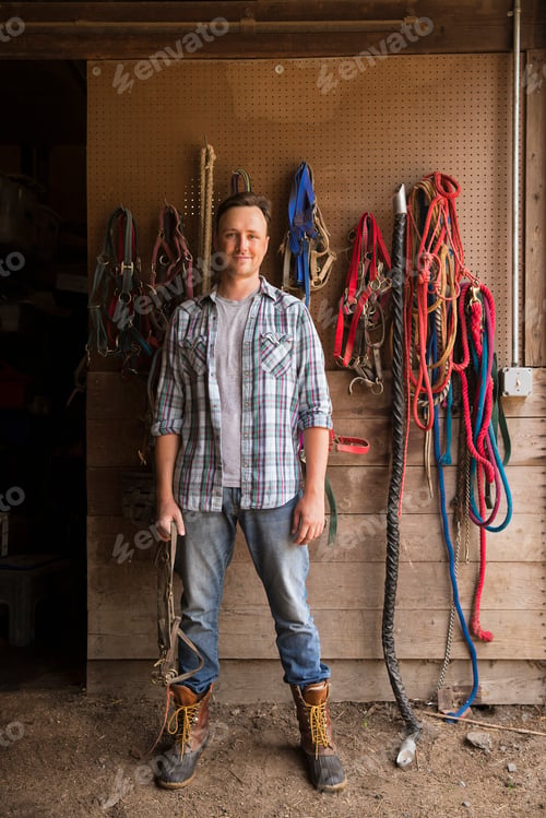 Preview: An organic farm in the Catskills. A man standing in a tack room in a stable.