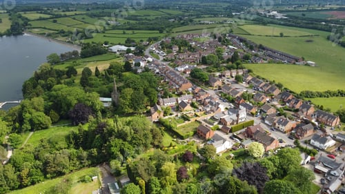 Preview: Aerial view of a village with a church and lake