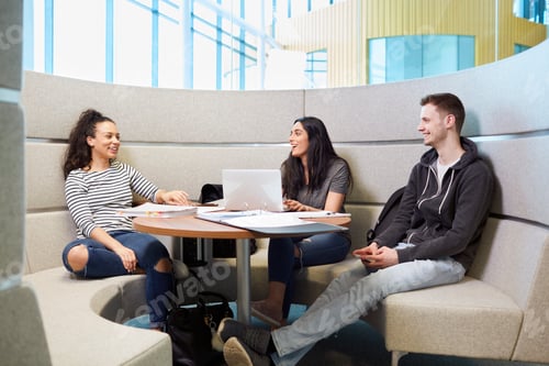 Preview: University students relaxing in modern seating area