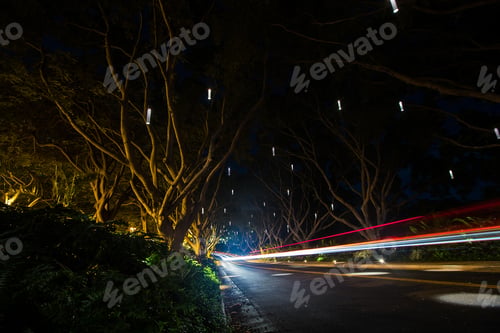 Preview: Blurred headlights on a moving car