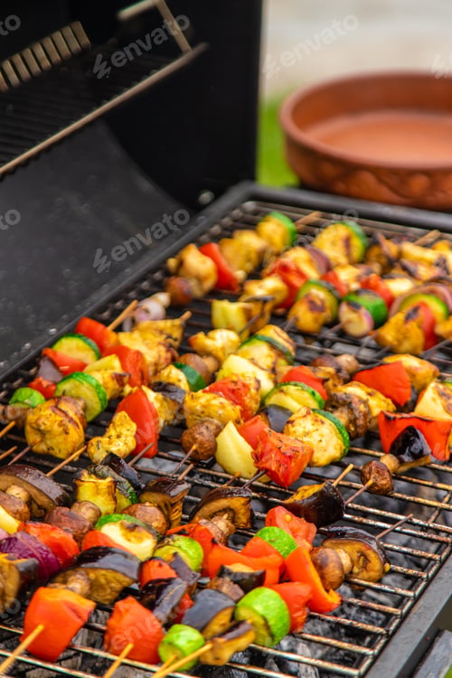 Preview: Vegetables and meat are fried on the grill. Selective focus.