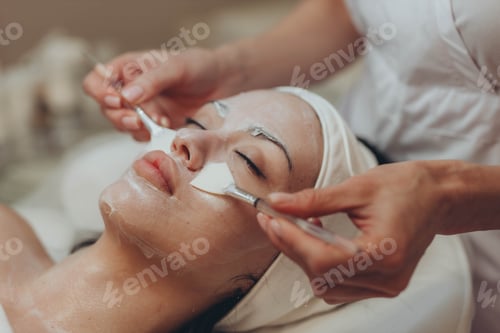Preview: woman at the cosmetologist. She has problem skin and acne.