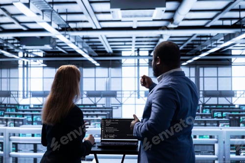 Preview: Manager overseeing data center next to employee, doing inspection