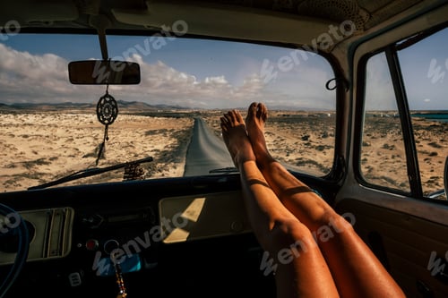 Preview: Travel and freedom concept people with close up of woman legs enjoy the road trip
