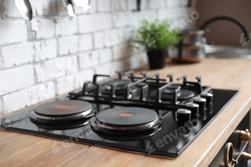 Preview: New modern stove with gas and electric burners in kitchen