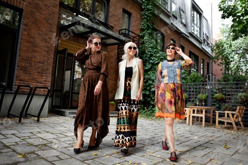 Preview: Group of full length elderly women having fun walking city street, happy mature woman outdoors