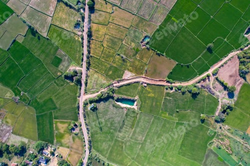 Preview: Aerial view of an agricultural field under the sunlight