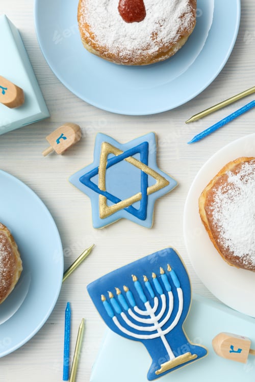 Preview: Gingerbread cookies with Jewish symbols and donuts on white background, top view
