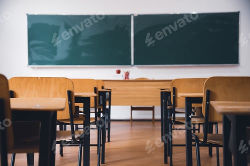 Preview: Classroom with empty wooden chairs and blackboard