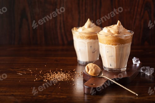 Preview: dalgona coffee in glass. trendy Instant coffee whipped with sugar and hot water