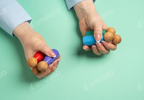 Preview: Woman holding figures of people. Concept of personnel management