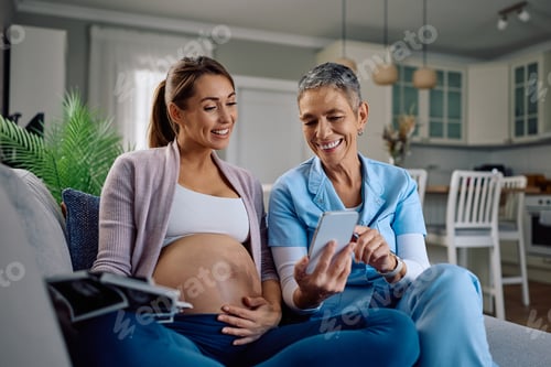 Preview: Pregnant Woman and Healthcare Worker Look at Phone