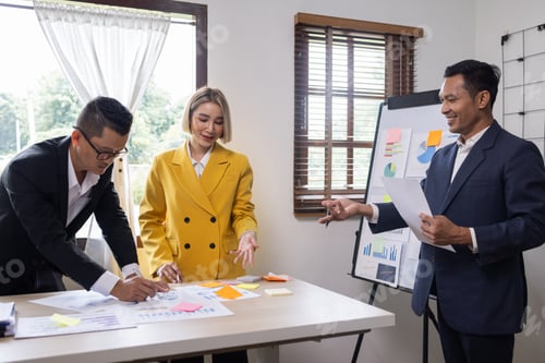Preview: Group of confident business people point to graphs and charts to analyze market data, balance sheet,