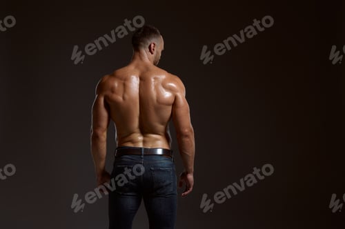 Preview: Male athlete with muscular body poses in studio