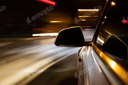 Preview: Car light trail while driving in the coty by night