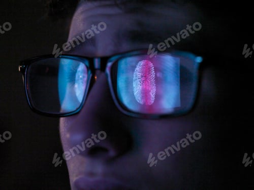 Preview: Cyber Security, reflection in spectacles of access information being scanned on computer screen